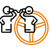 Zwei Personen im Gespräch mit Logo der Fahrschule Wichmann Rastede im Hintergrund